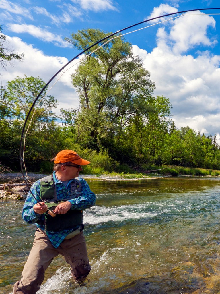 Man Fly fishing in river near his Basalt home